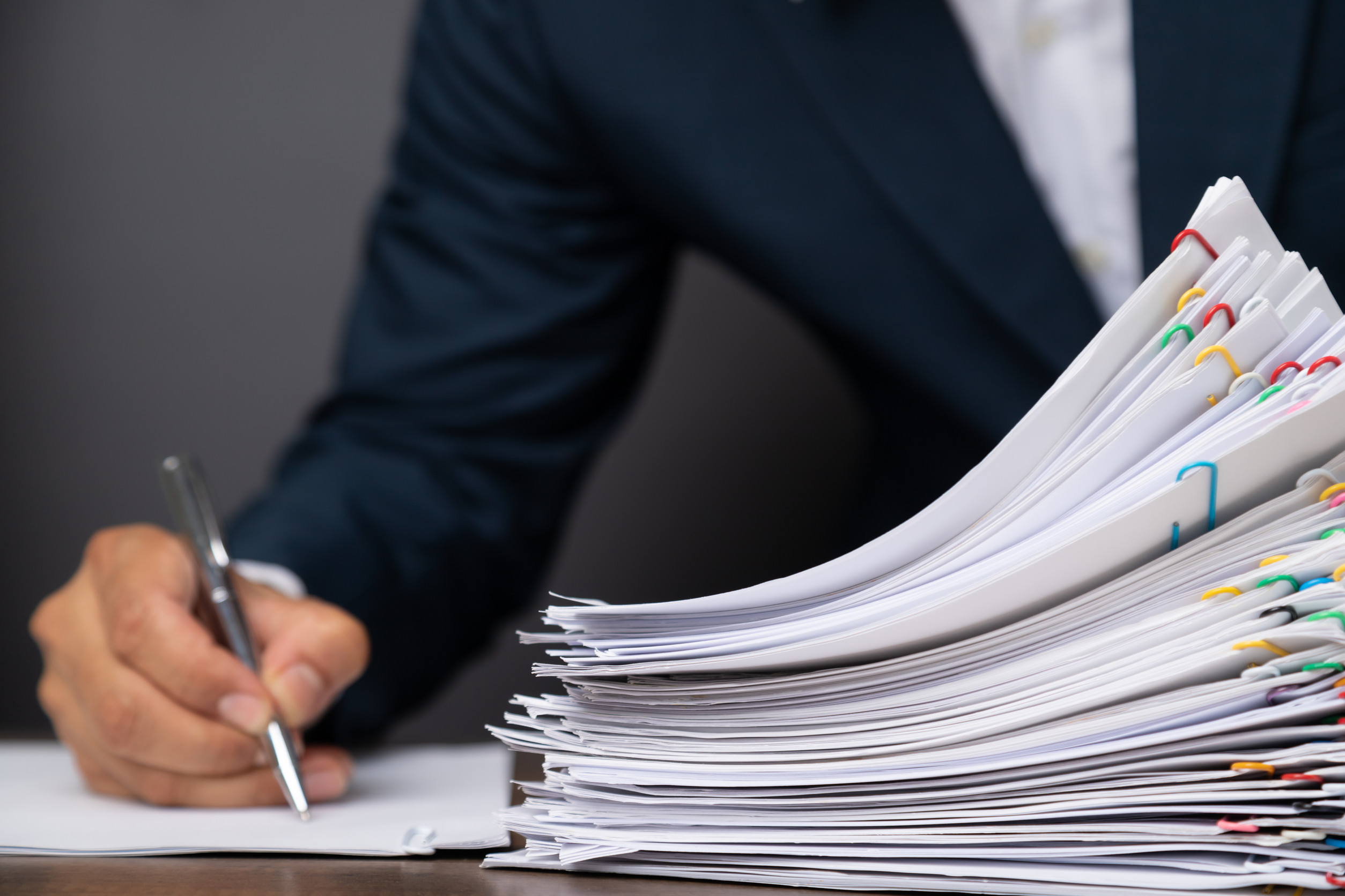 Stack of Group report papers Document.
